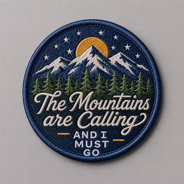 100% embroidery patch featuring mountains pine trees stars and text The Mountains are Calling AND I MUST GO