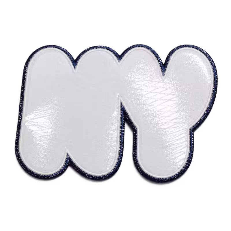white iron-on adhesive backing of a chenille patch with a dark blue stitched border on plain background